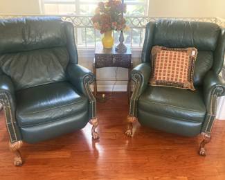 Matching green leather chairs