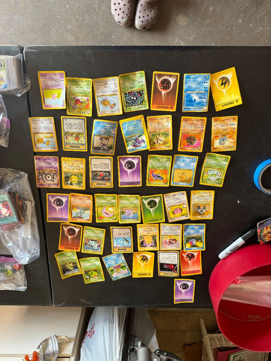  a collection of vintage Pokémon cards, perfect for collectors and fans alike! This assortment features classic cards from the original series, including iconic Pokémon like Charizard, Pikachu, and Mewtwo. Each card is in varying condition, showcasing the nostalgia of the 90s. You'll find a mix of holographic and non-holographic cards, as well as trainers and energy cards. Whether you're looking to complete your collection or just reminisce about the good old days, this bundle offers a fantastic trip down memory lane. Don’t miss your chance to own a piece of Pokémon history!