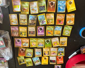 a collection of vintage Pokémon cards, perfect for collectors and fans alike! This assortment features classic cards from the original series, including iconic Pokémon like Charizard, Pikachu, and Mewtwo. Each card is in varying condition, showcasing the nostalgia of the 90s. You'll find a mix of holographic and non-holographic cards, as well as trainers and energy cards. Whether you're looking to complete your collection or just reminisce about the good old days, this bundle offers a fantastic trip down memory lane. Don’t miss your chance to own a piece of Pokémon history!