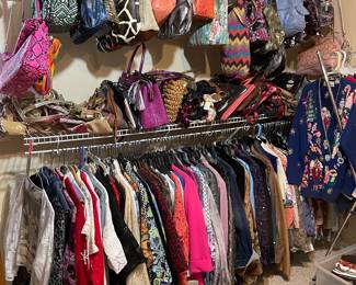Some of the many clothes & purses