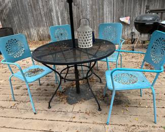 Patio table, chairs, and umbrella