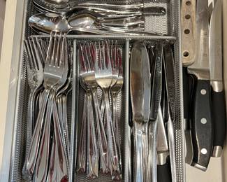Silverware and knives. Some of these knives are HENKLE  knives.