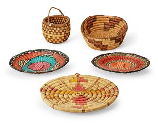 169
A group of Southwest basketry vessels
Early/mid-20th century; Southwest United States
Comprising a coiled handled basket with checkered motif (5.25" H x 6.375" Dia.), a coiled polychrome oval basket with stepped motif (3.75" H x 12.25" W x 9.875" D), a coiled polychrome plaque depicting a bird (15.25" Dia. x 1.875"D), and two twined polychrome wicker plaques (larger: 13.25" Dia.)
5 pieces
Estimate: $500 - $700