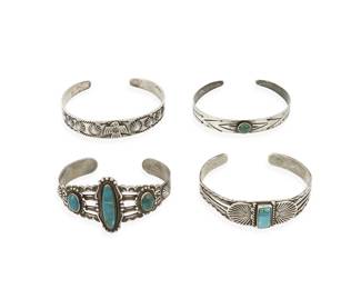 289
A group of Fred Harvey-style Southwest silver and turquoise cuff bracelets
Mid-20th century
One marked for Bell Trading Post and for sterling
Four narrow ornate silver and set turquoise cuffs, in various styles and sizes, with motifs including stampwork, thunderbirds, and crossed arrows, 4 pieces
Largest: 6 1/4" inner C x 1 1/4" H; smallest: 6" inner C x 3/8" H
63.4 grams gross
Estimate: $200 - $400
