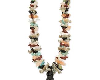 334
A Zuni Pueblo-style carved multistone fetish necklace
Late 20th century
A chunky necklace with a central large carved jet standing bear, flanked by stacked graduated multistone animals, with fine heishi beads and a silver cone clasp
29 1/4" L x 1 3/4" H
105.7 grams gross
Estimate: $200 - $400