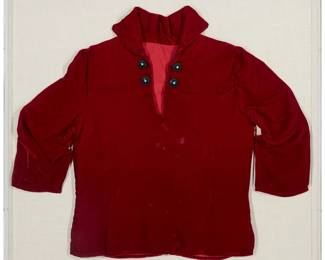 231
A framed Navajo red velvet child's shirt
20th century, Diné
A small traditional red velvet pullover shirt with a collar and four small concho buttons with set turquoise, professionally mounted and framed in a custom acrylic case
20.5" H x 23.5" W (as mounted); 14.5" W (at sleeves)
Estimate: $200 - $300