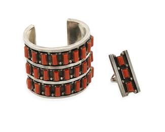 280
A set of Southwest sterling silver and coral jewelry
Mid/late 20th century
Stamped: BM [possibly Billy & Marie Yellowhair, Navajo/Diné]
Comprising a chunky sterling silver and row-set coral cuff bracelet, with a matching rectangular row-set coral ring, 2 pieces
Cuff: 6 1/4" inner C x 2 5/16" H; ring size: 7 1/4
184.4 grams gross
Estimate: $600 - $800
