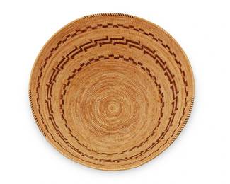 126
A Yokuts polychrome basket
Early 20th century; Southern California
A coiled basketry bowl with brown and yellow rim ticking and red and brown banded worm and millipede motifs to body
7" H x 13.25" Dia.
Estimate: $1,000 - $2,000