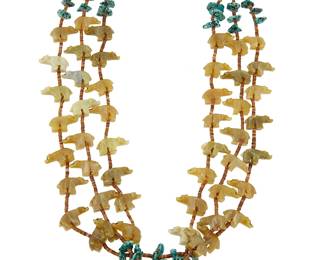 330
A Zuni Pueblo-style multistrand bear fetish necklace
Late 20th century
A triple-strand necklace featuring carved serpentine stone bears with nugget turquoise and heishi spacers
30 - 36" L
93.8 grams gross
Estimate: $200 - $300