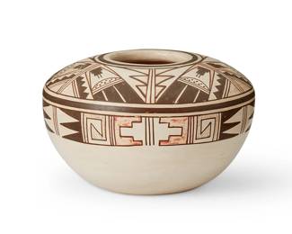 256
Claudina Lomakema (b. circa 1940, Hopi-Tewa)
A polychrome pottery jar, circa 1970s
Signed to underside: Claudina Lomakema
The three-color jar with banded stepped, whirlwind, and geometric motifs to broad shoulder and upper body
4.975" H x 7.875" Dia.
Estimate: $100 - $200