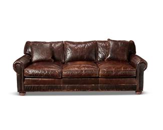 220
A Restoration Hardware "Lancaster" leather sofa
Late 20th/early 21st century
With Restoration Hardware tag under seat cushions
The low and deep three-seater sofa with leather upholstery over a wood casket, raised on bun feet, together with two matching leather pillows
3 pieces
35.5" H x 90" W x 48.5" D
Estimate: $600 - $800