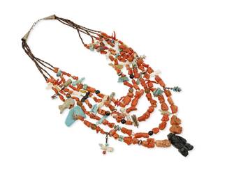 317
A Zuni Pueblo-style multistrand "grandmother" coral necklace
Late 20th century
Unmarked
A five-strand necklace with chunky graduated branch coral beads and a central carved jet standing bear, interspersed with a variety of found materials including tab turquoise, trade beads, carved stone fetish animals, and silver charm accents, all on olive shell heishi
22" L
223.2 grams gross
Estimate: $400 - $600