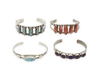 288
A group of Southwest silver and stone set cuff bracelets
Mid/late 20th century
Two marked: Sterling
Four narrow silver cuffs with various single and row-set stones including turquoise, sugilite, and spiny oyster, 4 pieces
Largest: 6 1/4" inner C x 3/4" H; smallest: 6" inner C x 3/4" H
83.2 grams gross
Estimate: $300 - $500
