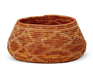 114
A California Mission polychrome basket
Early 20th century; Southern California
The coiled basketry bowl with orange and red star motif to underside, with floating diamond motifs to body
4" H x 8.125" Dia.
Estimate: $500 - $700