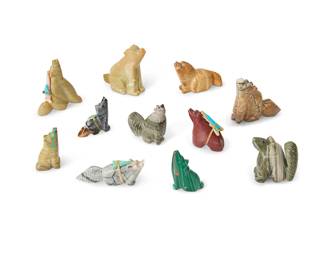 327
A group of Zuni carved stone wolf fetish figures
Mid/late 20th century
Each unmarked
Comprising eleven wolf figures, some attributed to various makers such as Emery Boone, Rozella Lunasee, and Eugene Mahooty, some with turquoise inlaid eyes, two with inlaid heartline, and three mounted with offerings
11 pieces
Largest: 2.5" H x 2.625" W x 1.125" D
Estimate: $100 - $200