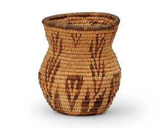 165
An Apache basketry olla
Early 20th century; Southwest United States
The coiled miniature olla with geometric arrow motifs
4.25" H x 3.5" Dia.
Estimate: $300 - $500