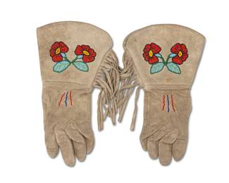 244
A pair of Native American beaded deer hide gloves
Mid-20th century
The gloves with flared cuffs, each lined with trade cloth to interior and adorned with beads depicting floral motifs to one side and hide fringe
2 pieces
Each: 12" L x 7.5" W
Estimate: $200 - $400
