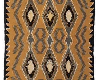 187
A Navajo regional rug
Mid-20th century, Diné
Woven in tan, cream, grey, and black, depicting three columns of conjoined serrated diamonds in a stepped border at two edges
87.5" H x 47" W
Estimate: $800 - $1,200