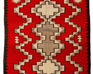 181
A large Navajo regional rug
Mid-20th century, Diné
Woven in red, black, cream, and natural grey/brown wool, depicting a central column of stacked stepped diamonds centering geometric elements within a sawtooth border
108" H x 75" W
Estimate: $1,000 - $1,500