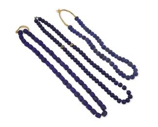 340
Three strands of Russian/Eastern European trade beads
Late 19th century and later
Comprising two strands in cobalt blue frosted glass beads, one strand with spherical beads (12mm) and raffia neck cord, and one with faceted rectangular beads (11mm), as well as a necklace of spherical blue glass beads (12mm) with two silver bead accents, 3 pieces
Largest: 29" L; smallest: 23" L
387.1 grams gross
Estimate: $400 - $600