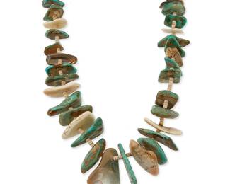 349
A Southwest Pueblo turquoise and shell tab necklace
Mid-20th century
A chunky single strand necklace with graduated tabs of turquoise and shell with white shell bead spacers and a wrapped neck cord
28" L
179.7 grams gross
Estimate: $600 - $800