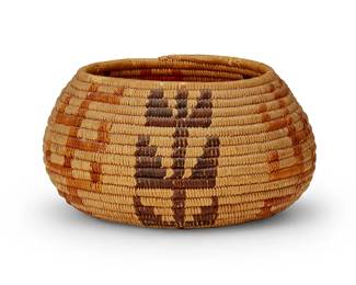 121
A California Mission polychrome basket
Early 20th century; Southern California
The coiled basketry bowl with alternating brown and yellow foliate motifs
3.875" H x 7" Dia.
Estimate: $300 - $500