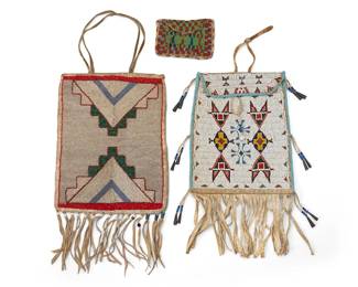236
Three polychrome beaded hide bags
Early/ mid- 20th century
Comprising a cloth-lined hide sack with beaded stepped motif to front and fringe to bottom, a flap-front sack with beaded floral motifs to front, beaded tassels terminating in tin cones, and fringe to bottom, and a small flap-front purse with geometric beaded motifs to front
3 pieces
Largest: 12" H x 9.5" W; Smallest: 3.5" H x 5.25" W
Estimate: $500 - $700