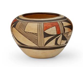 253
Joy Navasie, Second Frog Woman (1919-2012, Hopi-Tewa)
A yellowware polychrome pottery bowl, mid-20th century
Signed to underside with artist's frog cipher
The three-color bowl with banded geometric motifs to body
4.25" H x 6.375" Dia.
Estimate: $200 - $400