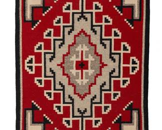 192
A Navajo Ganado rug
Mid-20th century, Diné
Woven in red, grey, cream, and black wool, depicting a central elaborate diamond motif with stepped motif corners
47" H x 30.75" W
Estimate: $300 - $500