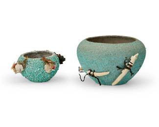 336
Two Zuni Pueblo turquoise encrusted fetish pots
Mid/late 20th century
Each unmarked
Comprising one larger pottery vessel with applied carved bone figural fox fetishes bound with offerings, and one smaller pot with applied feathers and carved jasper bear figure fetishes bound with offerings
2 pieces
Larger with fetishes: 4.75" H x 8.5" Dia.; Smaller with fetishes: 3.25" H x 6.625" Dia.
Estimate: $200 - $400