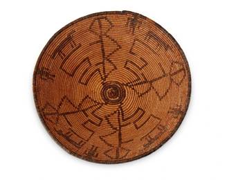 158
An Apache pictorial basket
Early 20th century; Southwest United States
The coiled basketry bowl with four figures and cows alternating within geometric motifs
3.875" H x 13.375" Dia.
Estimate: $800 - $1,200