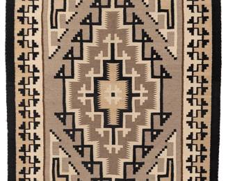 197
A Navajo regional rug
Mid-20th century, Diné
Woven in cream, grey, and brown wool with black and grey, depicting a Two Grey Hills central intricate diamond motif within an elaborate stepped border
52.5" H x 38" W
Estimate: $400 - $600