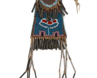 237
A Native American beaded hide strike-a-lite bag
Late 19th/early 20th century
The possibly Kiowa stiff hide flap-front bag for carrying fire-starting flint and an awl, adorned with beads depicting a floral motif and tin cone fringes
Without fringe: 4" H x 3.125" W x 0.5" D
Estimate: $800 - $1,200