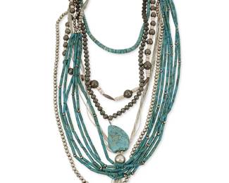 363
A group of Southwest silver and turquoise necklaces
Mid/late 20th century
Comprising a multistrand hand rolled barrel turquoise necklace, a silver bead necklace with large turquoise nugget pendant, a smaller turquoise bead choker, as well as a multistrand liquid silver necklace, a silver bead necklace with shell spacers and a long silver bead necklace, 6 pieces
Largest: 36" L; smallest: 18 1/2" L
326.7 grams gross
Estimate: $300 - $500