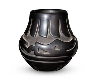 260
Stella Chavarria (b. 1939, Santa Clara Pueblo)
A blackware pottery olla, late 20th century
Signed to underside: Stella Chavarria / Santa Clara
The deeply incised vessel bearing an avanyu motif
4.75" H x 4.625" Dia.
Estimate: $500 - $700