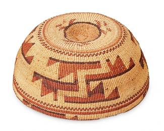 138
A Hupa/Yurok/Karuk polychrome basketry hat
Early 20th century; Northern California
The twined hat with imbricated banded stripe and figural geometric motifs
3.25" H x 7.25" Dia.
Estimate: $300 - $500