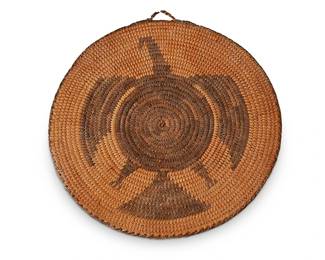 154
A Southwest pictorial basketry tray
Early 20th century
The flat coiled tray with brown figural eagle centering a brown rim, featuring a small handle at top
9.5" Dia.
Estimate: $200 - $400