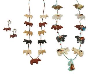 352
A group of Southwest carved stone fetish jewelry
Late 20th century
Three works:

Ron Upshaw (b. 20th century, Diné)
A Navajo carved fetish necklace
Stamped to hangtag: R.U.
With carved multistone animals with fetish feather bundles on turquoise heishi
32" L

A group of Zuni-style carved stone fetish horse jewelry
Unmarked
Featuring a single strand of carved multistone horses with heishi and turquoise spacers, as well as a pair of matching earrings, 3 pieces
Necklace: 29" L; earrings: 1 1/2" H

4 pieces total
181.5 grams gross
Estimate: $200 - $400