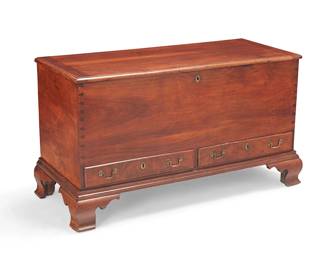 219
A Queen Anne-style blanket chest
Late 19th century
The large solid wood construction chest with dovetail joints, featuring a hinged top with locking mechanism above two small locking drawers with brass pulls, raised on shaped bracket feet
28" H x 51.5" W x 22" D
Estimate: $600 - $800