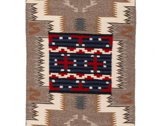 203
A Navajo sampler runner
Mid/late 20th century, Diné
Woven in multicolor wool, depicting a central Third Phase-style chief's blanket pattern within a stylized storm pattern at center, flanked by opposed geometric floating elements
60.25" H x 17.5" W
Estimate: $300 - $500