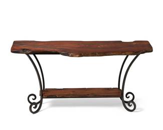 227
A Spanish-style wood and iron console table
Late 20th/early 21st century
The table with live edge wood tabletop and undershelf supported on a black enameled wrought iron frame with scrolled feet
29.75" H x 60" W x 21.25" D
Estimate: $500 - $700