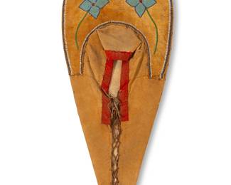 234
A Woodlands beaded hide cradle board
Early 20th century
The wood board wrapped in fibrous cloth with metal tacking to sides, featuring a beaded hide panel adorned with beads depicting floral motifs with outer trim
37.5" H x 16.5" W x 2.5" D
Estimate: $500 - $700