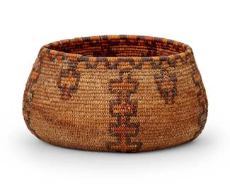 120
A California Mission polychrome basket
Early 20th century; Southern California
The coiled basket with rim ticking above vertical yellow stacked cross motifs alternating with floating crosses, each in a brown outline
4.75" H x 8.75" Dia.
Estimate: $400 - $600