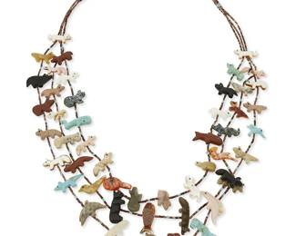339
A Johnny Sheeka Zuni multistrand carved fetish necklace
Johnny Sheeka [or Shika] (b. 20th century, Zuni Pueblo)
Late 20th century
Unmarked
A three-strand carved multistone and shell fetish necklace with various animal figures including buffalo, bighorn sheep, whales, frogs, dolphins, fish, and woodpecker, with heishi spacers and silver cone clasps
27" L
99.0 grams gross
Estimate: $200 - $400