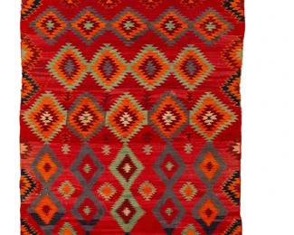 186
A Navajo double saddle blanket
Late 19th century, Diné
Woven in multicolor wool depicting an eyedazzler pattern of stacked serrated diamonds on a red ground, one end with fringe
50" H x 33" W
Estimate: $800 - $1,200