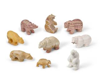 281
A group of Zuni carved stone bear fetish figures
Mid/late 20th century
One marked and attributed to Tony Chapito
Comprising nine bear figures, some with turquoise inlaid eyes, two with carved shell salmon in their mouths
9 pieces
Largest: 3.25" H x 5.25" W x 2" D
Estimate: $200 - $400