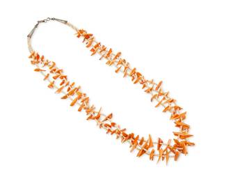316
A Southwest Pueblo coral and melon shell necklace
Late 20th century
A three-strand necklace with stylized carved coral birds with melon shell heishi spacers and silver cone clasp
30 3/4" L
105.5 grams gross
Estimate: $400 - $600