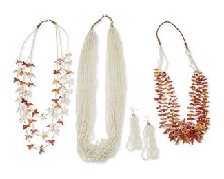 361
A group of Southwest necklaces
Late 20th century
Four works comprising a carved shell fetish necklace with hummingbird figures and white shell spacers, as well as a multistrand graduated shell fragment necklace with shell and clam bead spacers, and a multistrand white glass bead necklace with a pair of matching earrings, 5 pieces
Necklaces: 23 1/2" L; 26" L; 32" L; earrings: 4 1/8" H
433.6 grams gross
Estimate: $500 - $700