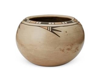 261
Crucita (Blue Corn) Calabaza (1921-1999, San Ildefonso Pueblo)
A polychrome pottery jar, mid-20th century
Incised to underside: Blue Corn / San Ildefonso Pueblo
The three-color jar with eagle feather and banded motifs to rim on a grey/white slip glaze, featuring a micaceous interior
4.625" H x 6.875" Dia.
Estimate: $500 - $700