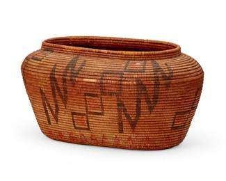 118
A California Mission polychrome basket
Early 20th century; Southern California
The coiled oval basket with elevated rim, featuring brown geometric motifs to body and yellow alternating sawtooth motif to base
5.5" H x 10.75" W x 7.125" D
Estimate: $700 - $900